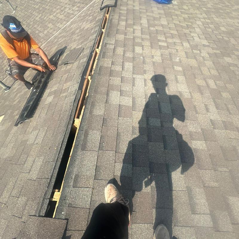 Ridge cap installation on asphalt shingle roof