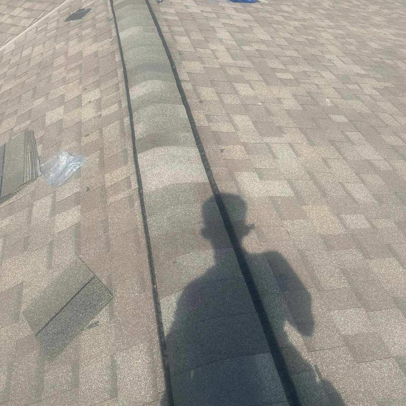 Ridge caps installation on asphalt shingle roof