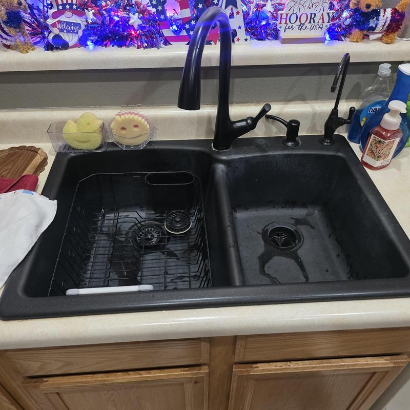 Kitchen sink drain with dual basin and black faucet Kitchen sink drain with dual basin and black faucet