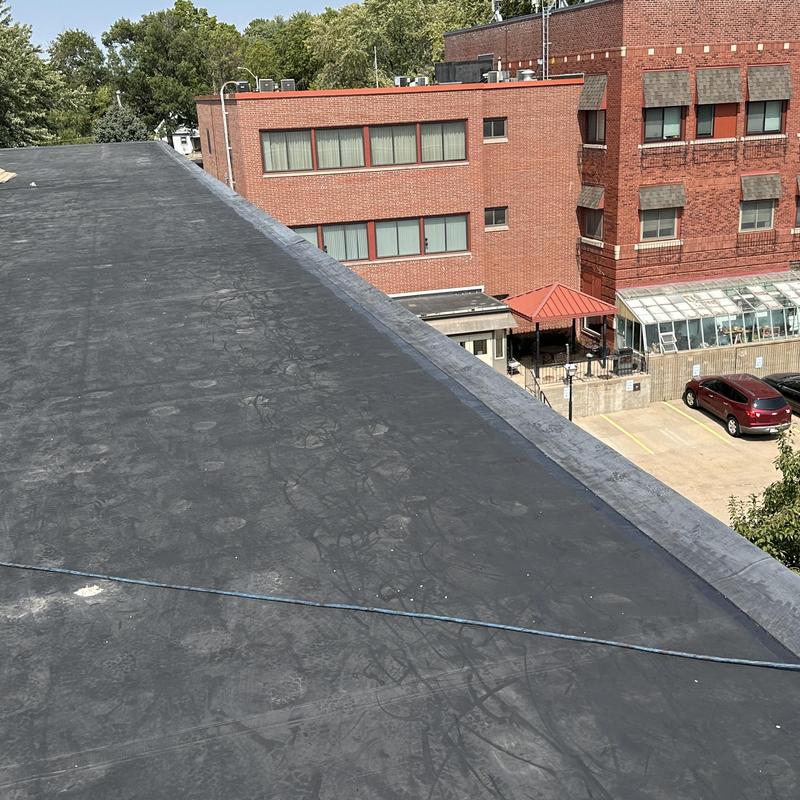 EPDM rubber roofing with cover strip on flat roof
