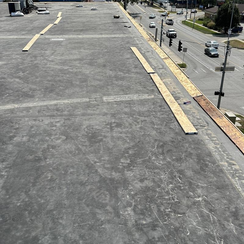 Carlisle Sure-Seal EPDM roof cover strips installation