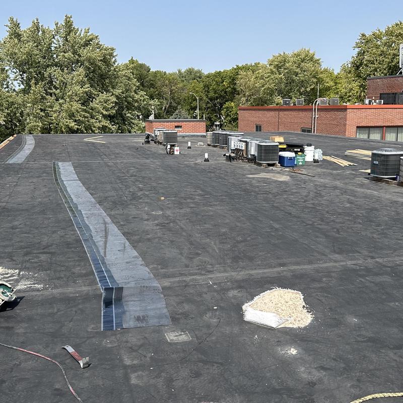 Carlisle Sure-Seal EPDM roof cover strip installation