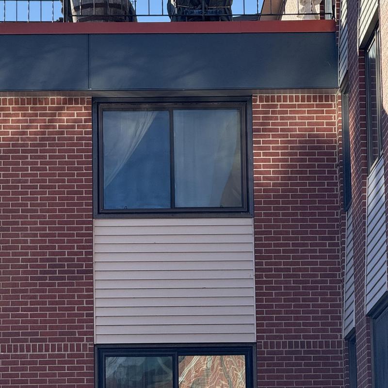 Window installation on brick and siding exterior
