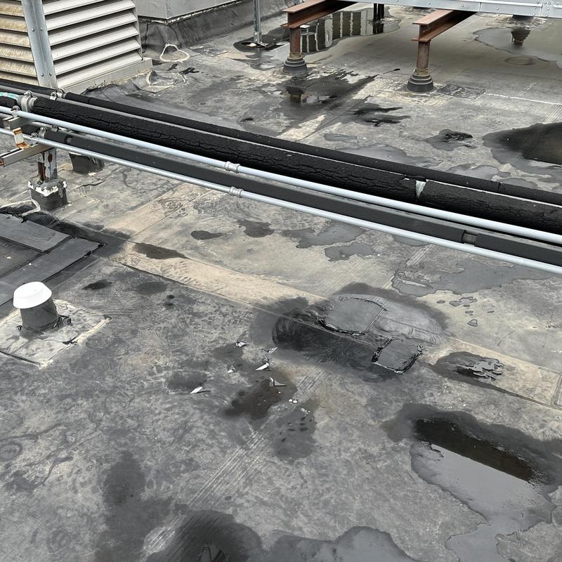 Johns Manville EPDM roof sealing strip repair on flat roof