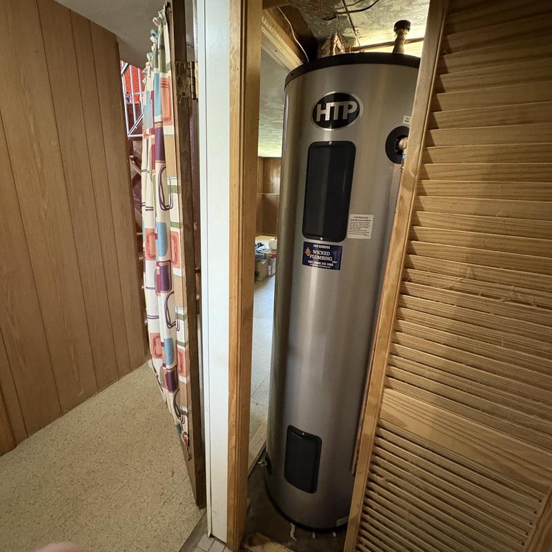Electric HDP water heater installed in basement closet