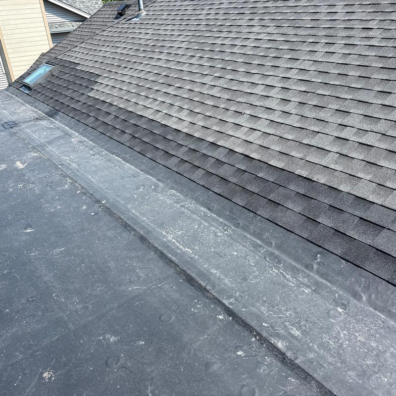 EPDM roofing and shingle roof intersection in Lincoln, NE