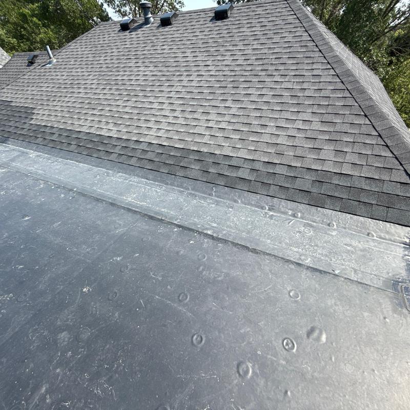 EPDM roof membrane and shingle roof intersection
