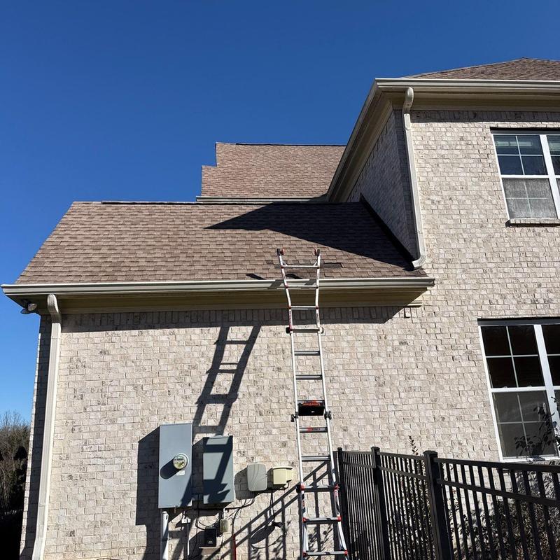 Asphalt shingle roof with ladder for inspection
