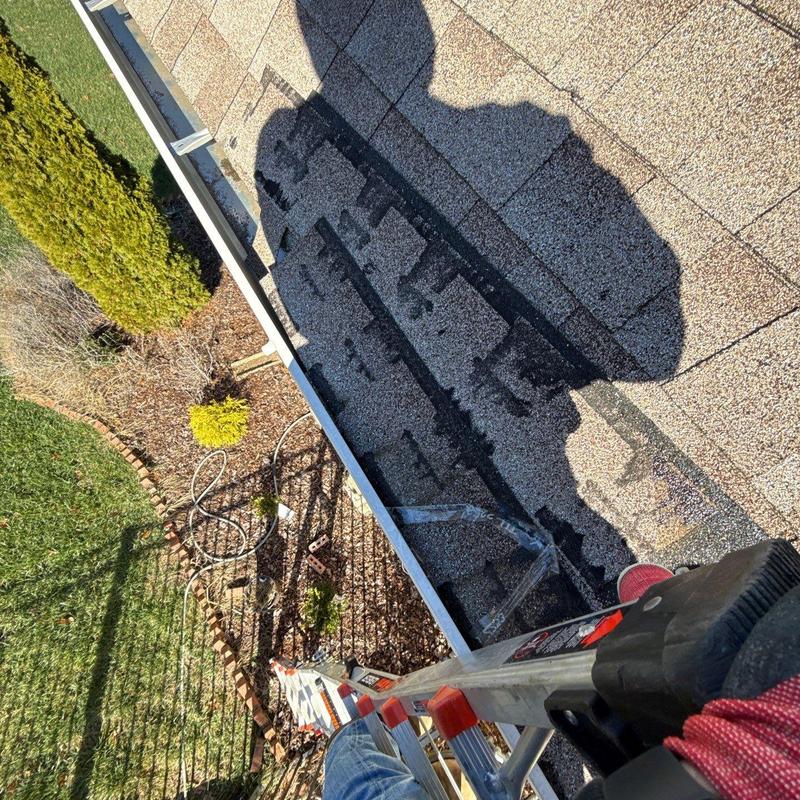 Asphalt shingles with hail damage inspection on roof