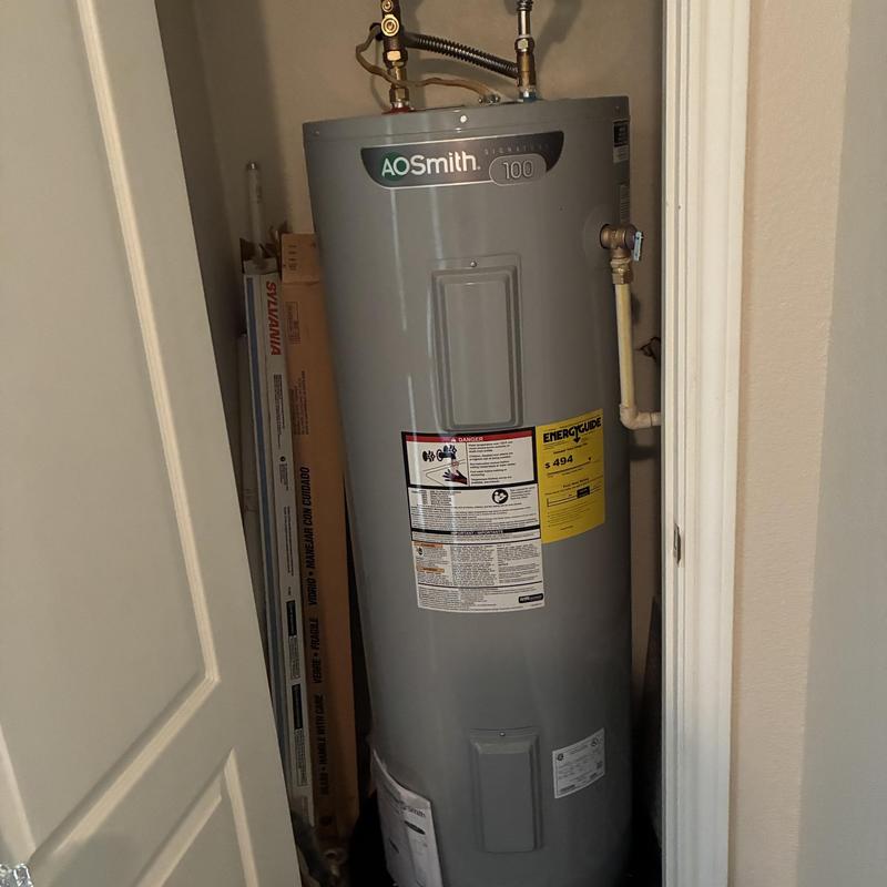 AOSmith 100-gallon water heater in storage closet