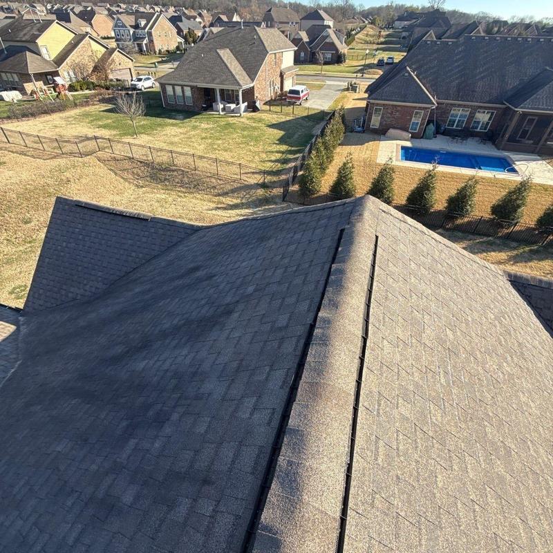 Roof shingles with hail damage inspection in suburb