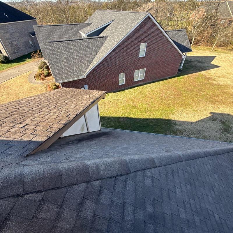 Asphalt shingle roof with hail damage inspection