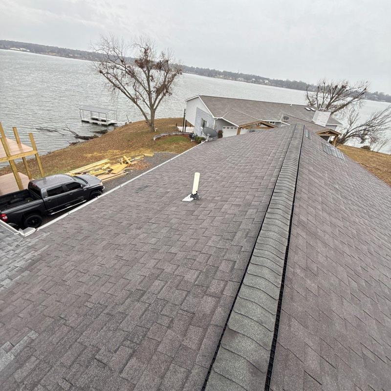 Asphalt shingle roof with ridge vent inspection