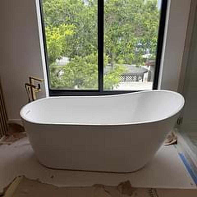 Freestanding bathtub installation in bathroom remodel