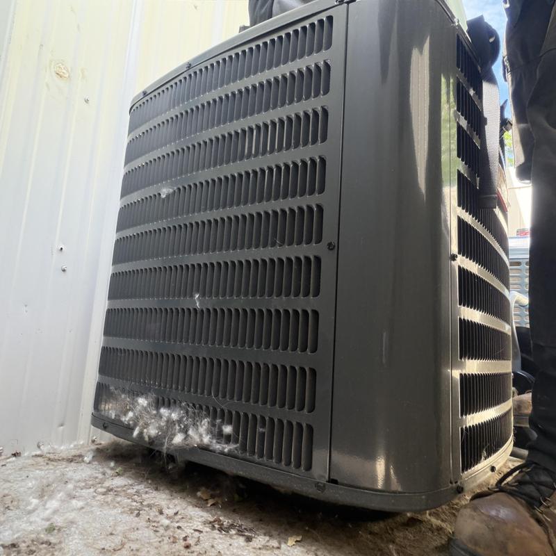 Central air conditioner unit with debris buildup Central air conditioner unit with debris buildup