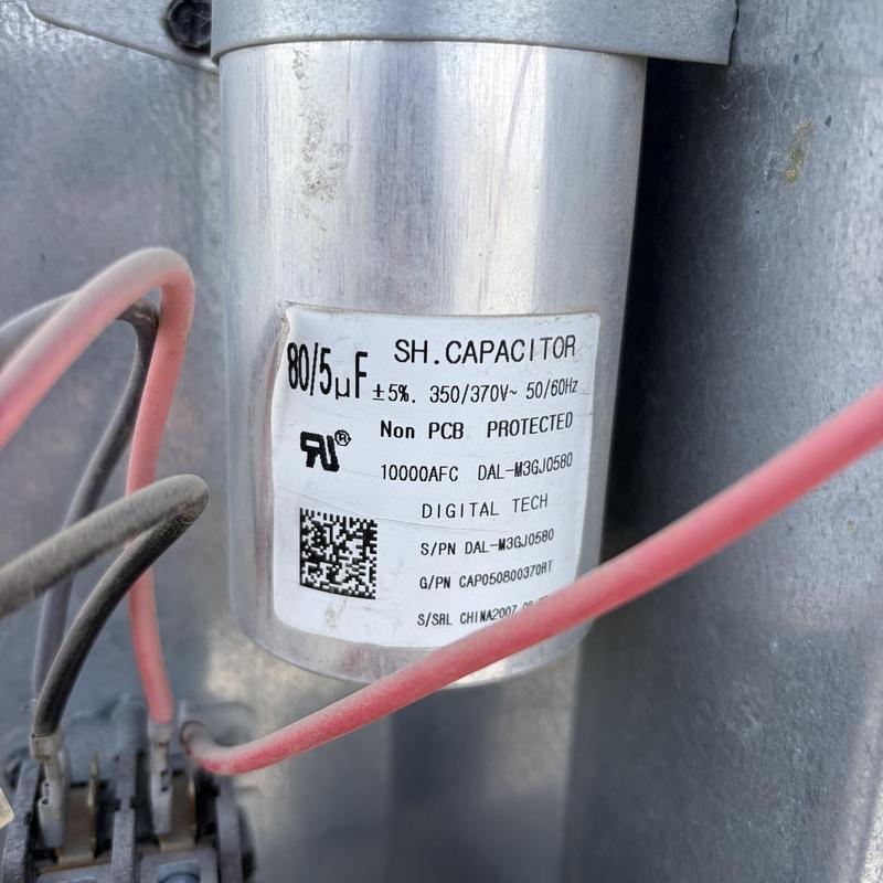 Start capacitor on HVAC system with wiring connections Start capacitor on HVAC system with wiring connections