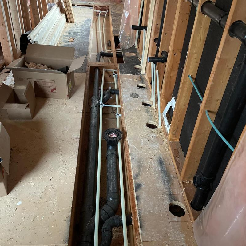 Sewage ejection pump and repiping in floor trench Sewage ejection pump and repiping in floor trench