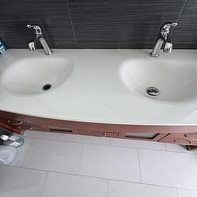 Dual bathroom faucets installed and connected in guest bathroom