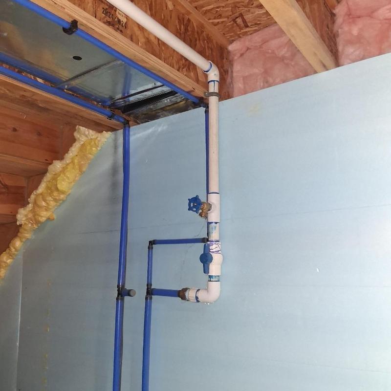 Sprinkler tap and blue PEX plumbing installation