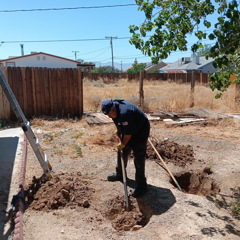 Concrete septic tank riser installation site digging