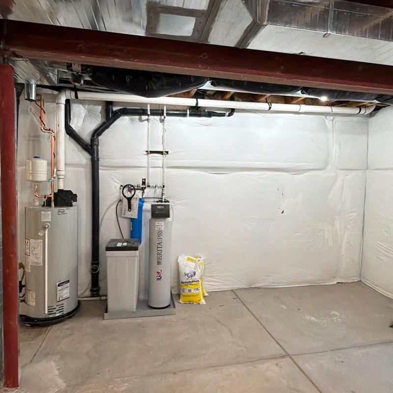 Power vent water heater with new vent piping installation Power vent water heater with new vent piping installation