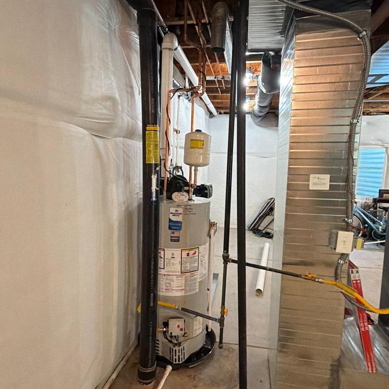 Power vent water heater and repipe venting pipes in basement Power vent water heater and repipe venting pipes in basement