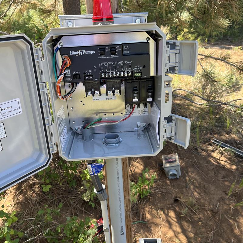 Sump pump electrical control panel installation outdoors Sump pump electrical control panel installation outdoors
