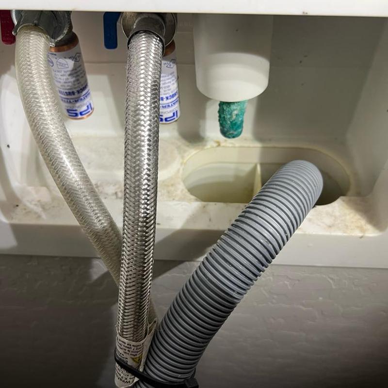 Kitchen sink drain clean-out with hoses and tubing Kitchen sink drain clean-out with hoses and tubing