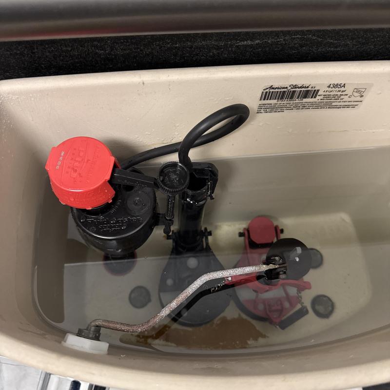 Toilet fill valve with new replacement installed