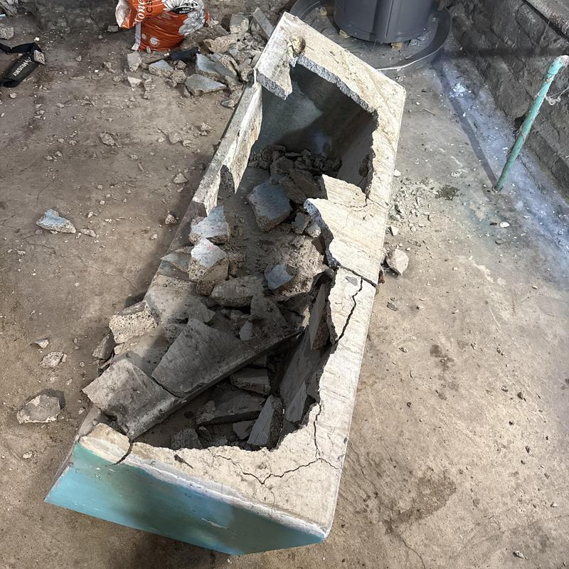 Concrete utility sink demolition and debris cleanup