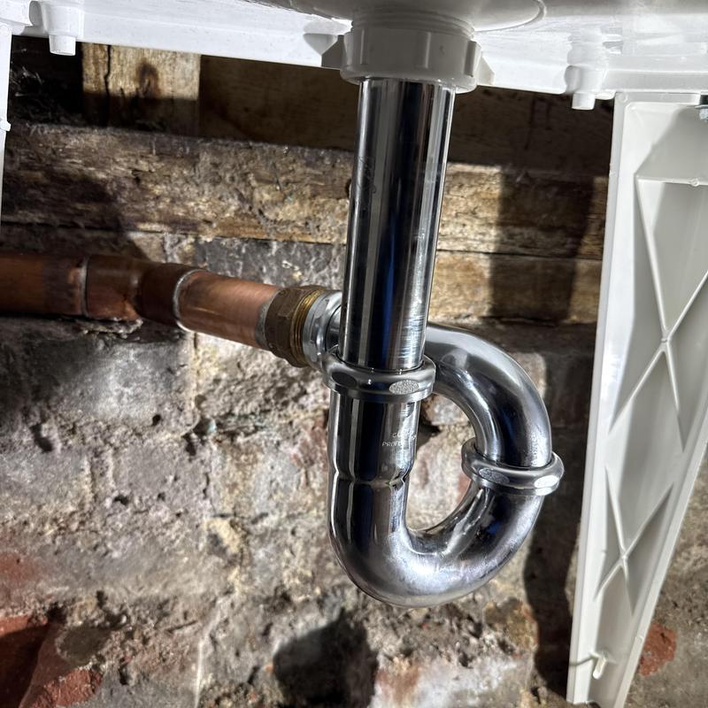 P-trap drain assembly under utility sink