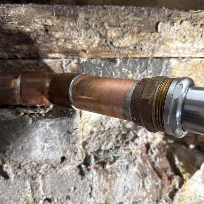 Copper water supply pipe with compression fitting installation