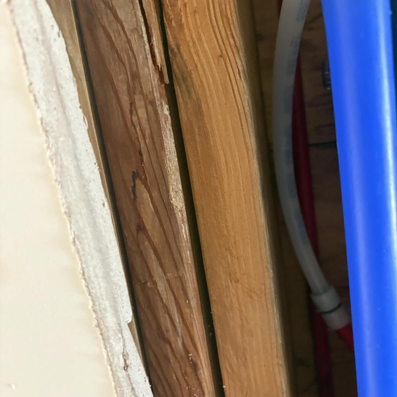 PEX water line tee in garage wall with leak repair