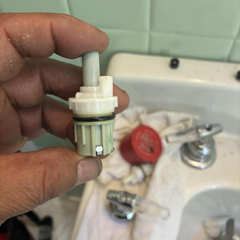 Basin faucet gasket and spring assembly replacement