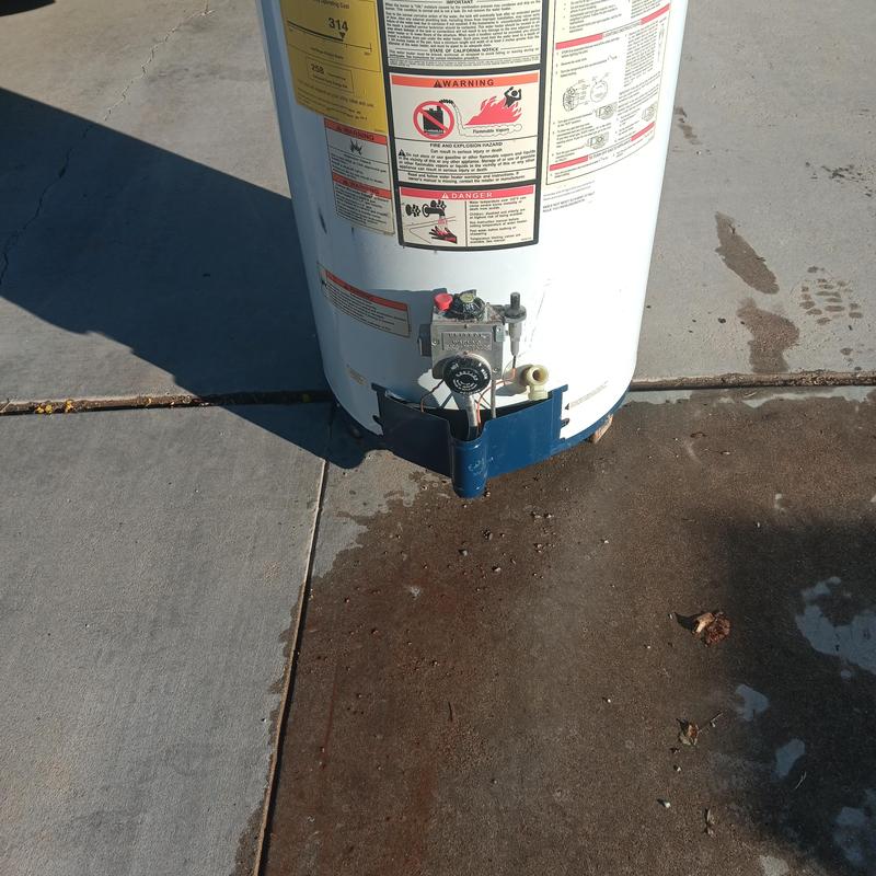 Natural gas water heater leaking on concrete floor