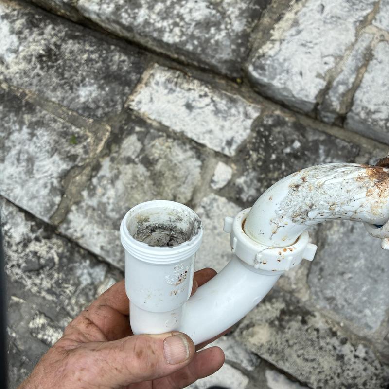 PVC drainpipe with corrosive buildup and clamp connection PVC drainpipe with corrosive buildup and clamp connection