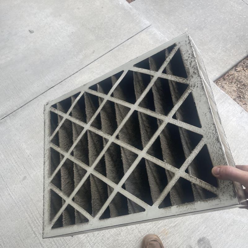 Clogged 16x20x4 air filter removed from HVAC unit