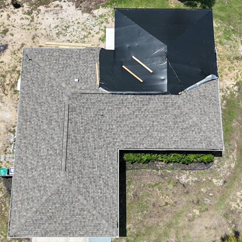 Asphalt shingle roof with temporary dry-in cover Asphalt shingle roof with temporary dry-in cover