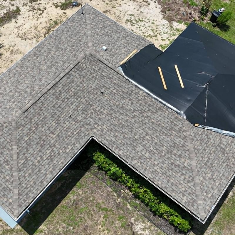 Asphalt shingle roof with temporary dry-in cover Asphalt shingle roof with temporary dry-in cover