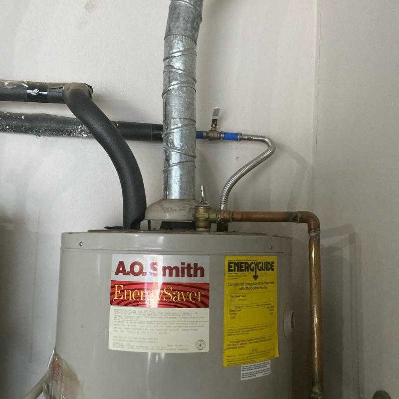 Water heater emergency shut off valve installation near vent pipe