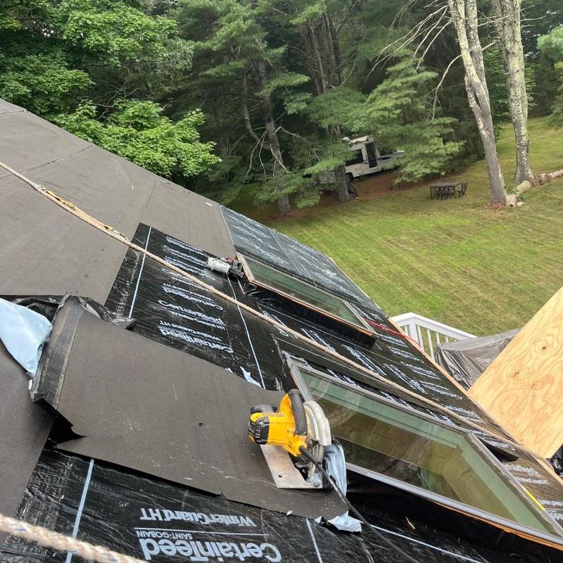 Roof underlayment with skylights installation in progress Roof underlayment with skylights installation in progress
