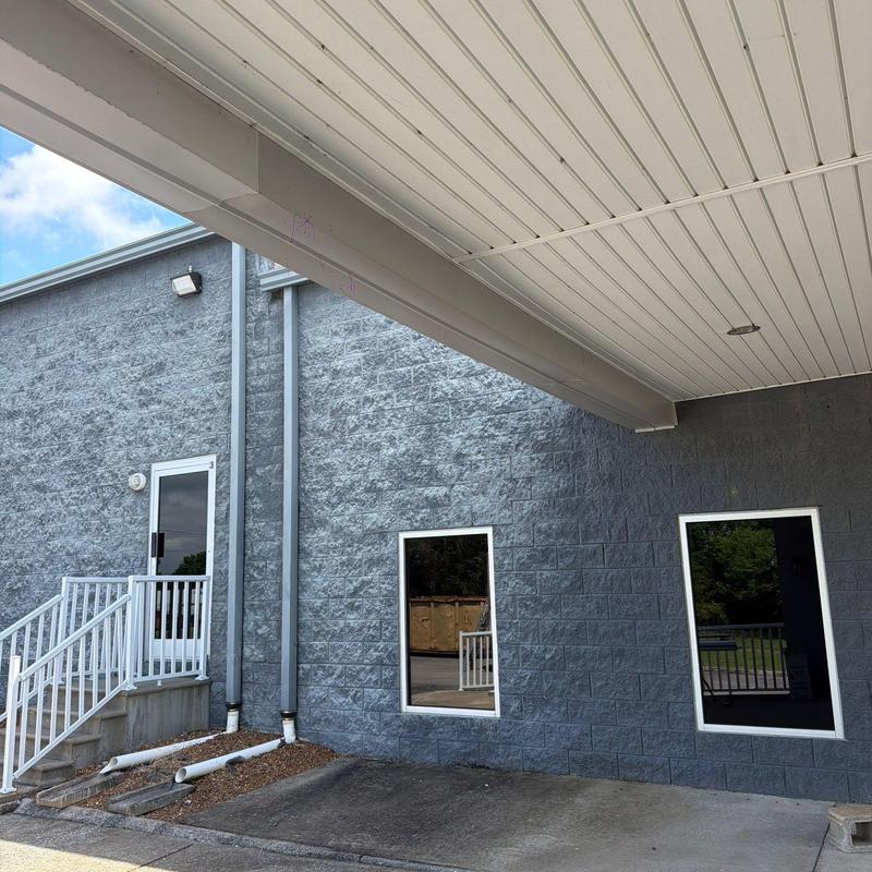 Vinyl soffit under building overhang with lighting fixture