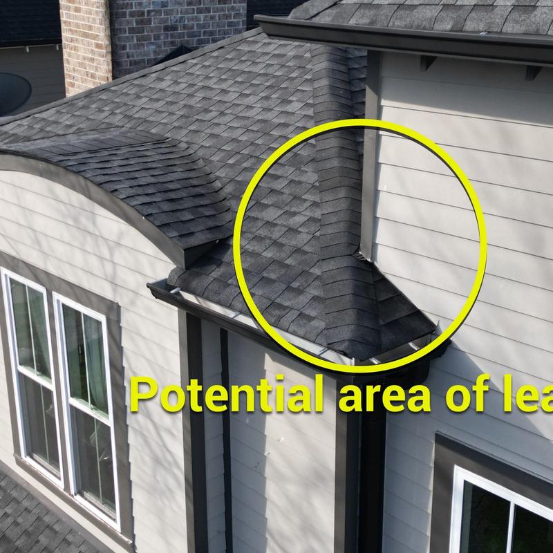 Roof valley flashing with potential leak area circled