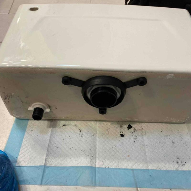 Commode tank with new gaskets and fittings installed