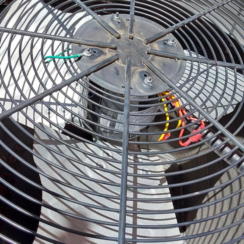 Condenser fan motor and capacitor inside AC unit grille