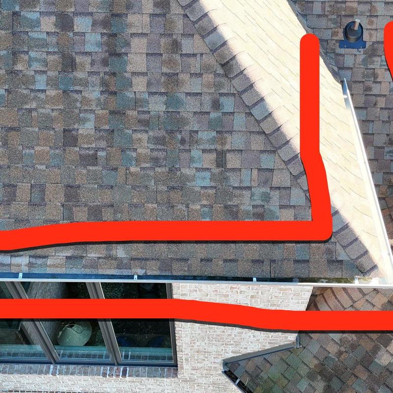 Roof shingles with hail damage marked for repair