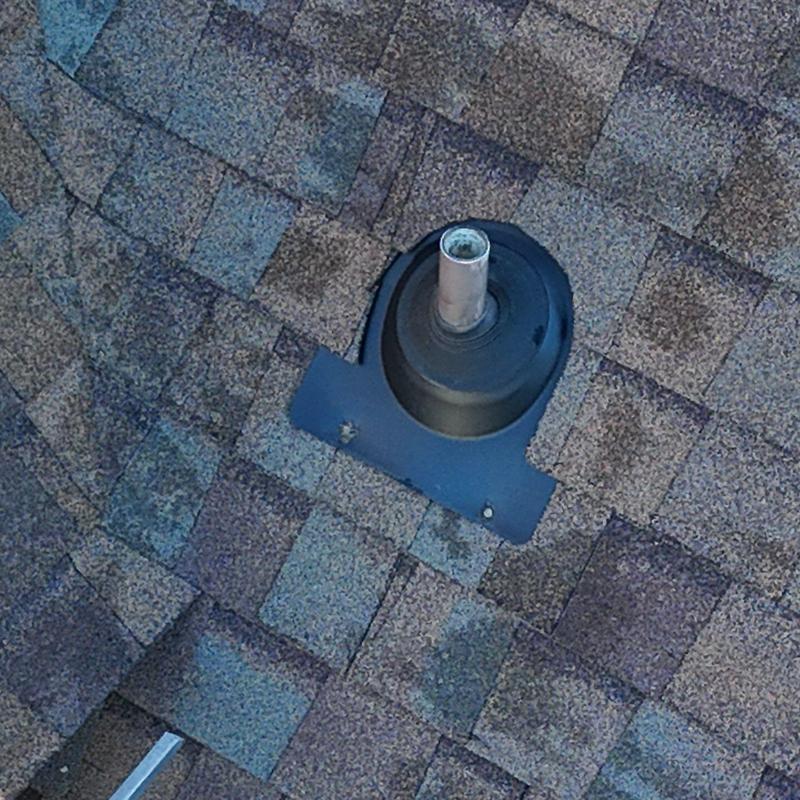 Roof pipe flashing on asphalt shingle roof