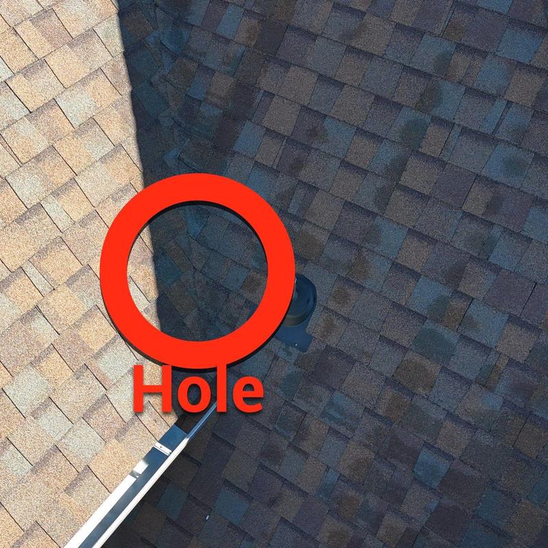 Roof shingles with hail damage hole marked
