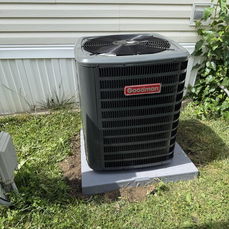 Goodman outdoor air conditioner unit on concrete pad
