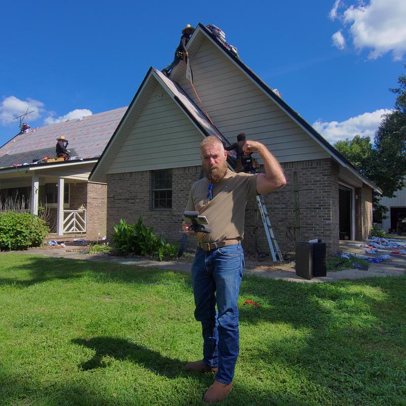Charcoal shingle roof with black eave metal installation Charcoal shingle roof with black eave metal installation